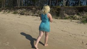 Milf teases pussy on the beach