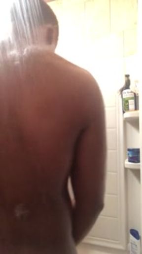 Black teen plays with big dick and fat ass while showering