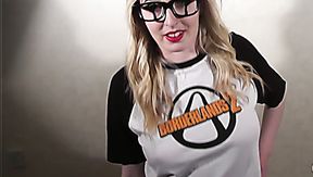 Lusty blonde gamer in glasses masturbates with joystick and a dildo