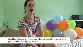 anna blows balloons in front of you