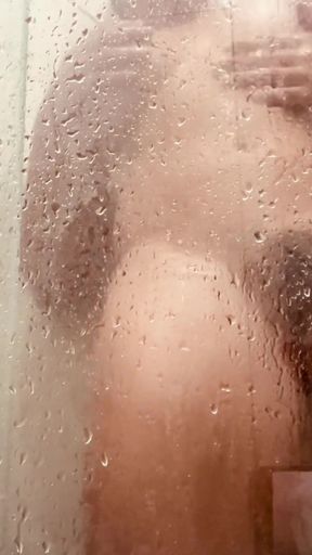 Captivating moment from "MILF Filming Herself Washing Her Hairy Pussy in the Bathroom"