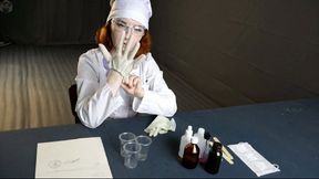 Laboratory technician in a vacuum bed with a pear gag and vibro