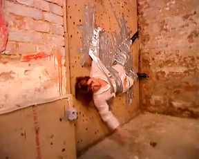 Kinky Stud Gets a Unique Blowjob From a Slut Taped on a Wall