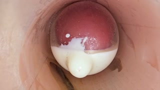 The camera in the deep pussy records a huge ejaculation of sperm into the condom