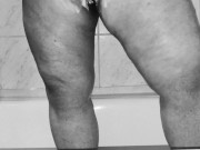 Chubby MILF shaves her pussy in the shower - black and white