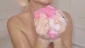 SmokerQueenJoan takes a bubble bath and enjoys smoking a 120 while gently lathering her body with a sponge