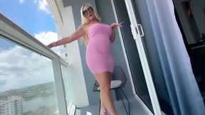 Beautiful Blonde shows her curves in tiny pink dress
