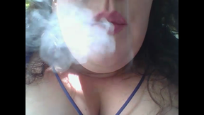 smoking cigar in backyard