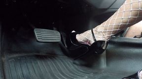Shiny black stripper heels and fishnets pounding the pedal