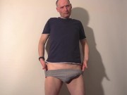 Kudoslong strips to underwear and t-shirt and wanks as he putts them on his cock and around his neck