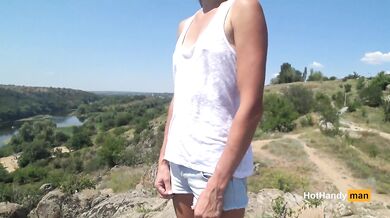 Braless hiker flashes small pale tits on the public beach