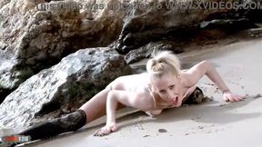 Blonde MILF Yelena Vera strips outdoors by the sea