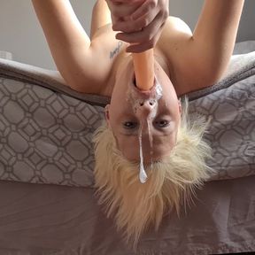 Blonde whore fucks her own throat with dildo