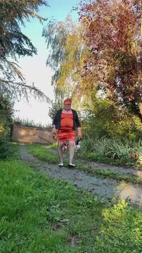 Dressed in a tight-fitting orange dress for a night out