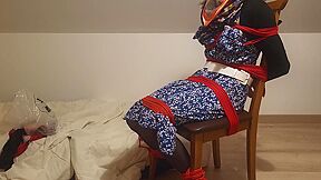 Girl Chairtied With Ropes And Scarf