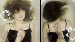 Lisa is underwater with a foot on her chest