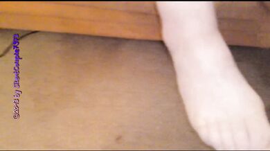 Her nylon feet smothered his face in a lewd massage