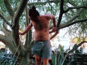 Nudist Hippie peeing from a tree