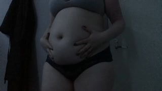 Feedee plays with empty and full bellyplay