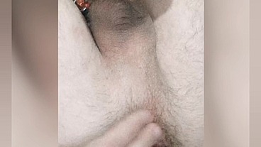 So hot twink enjoys a big anal ball and cums from a strap-on. His anal spits natural lube