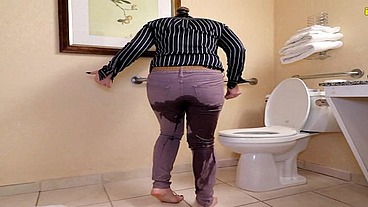 Whitney locked belt peeing her pants by toilet