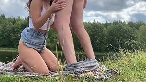 Outdoor riverside fuck with a skinny girl in a denim skirt