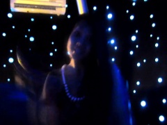 Slender dark-haired bombshell has a great time in the dark room
