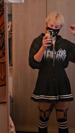 Gamer girl in fishnet stockings and black hoodie