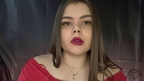 Latina smokes and holds the smoke in before exhaling