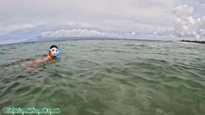 Carissa snorkeling in the Pacific Ocean in the hibiscus bikini