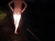 Fishnet bodysuit outside with passing car