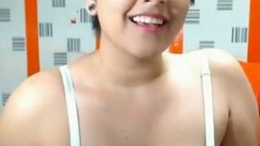 Webcam solo with a chubby amateur brunette flashing her cleavage