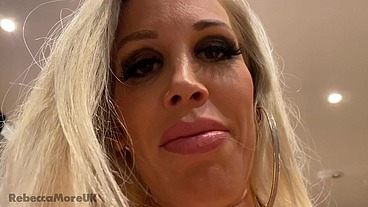 Rebecca More dominating her submissive male with her huge boobs and red lips