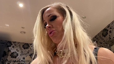 Rebecca More dominating her submissive male with her huge boobs and red lips
