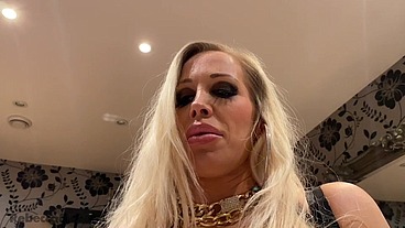 Rebecca More dominating her submissive male with her huge boobs and red lips