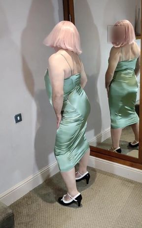 Hot crossdresser in green satin dress