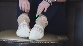Removing Her Boots and Socks