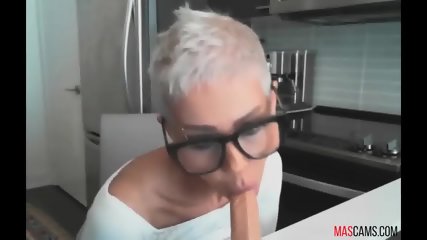 Blonde nerd girl licking dildo on webcam