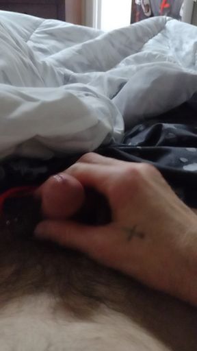 Stroking my cock.