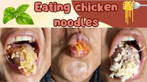 Eating long noodles with chicken