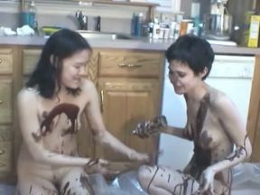 Two tasty skinny chicks cover each other's bodies with chocolate