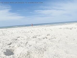 Crossdresser wearing blue tie side bikini at public beach