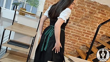 SENSUAL LATINA CARPENTER CUTTING WOOD IN A DIRNDL