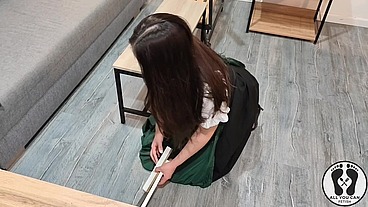 SENSUAL LATINA CARPENTER CUTTING WOOD IN A DIRNDL