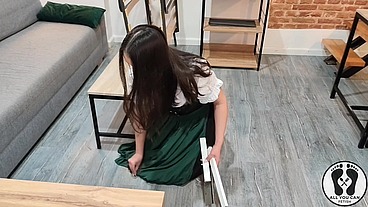 SENSUAL LATINA CARPENTER CUTTING WOOD IN A DIRNDL