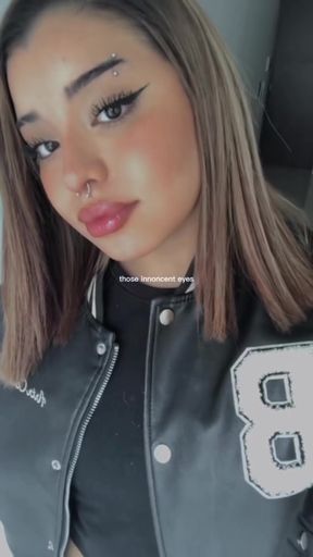 Sexy blonde woman in black and white jacket