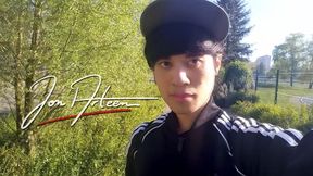 Freeballing public twink walks outdoors commando no underwear beneath black Adidas tracksuit Campus sneakers while out cruising