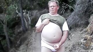 Amateur dude jerks off and takes a cumshot in public with bear-sized dick