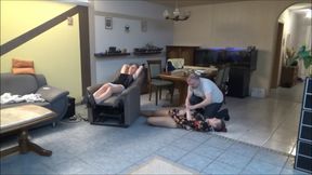 two women bound up in the living room by the master