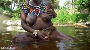 Big tittie zulu aunty washing herself in a tropical forrest river